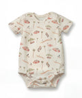 Baby onesie with nature-themed print on a white background