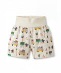 Shorts with a tropical pattern featuring cars, palm trees, and flamingos on a white background.