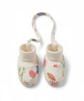 Pair of baby booties with floral design on a white background