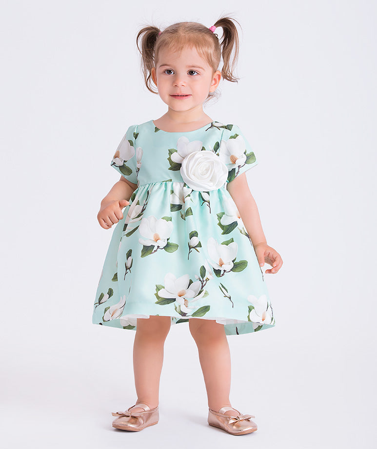 Mint floral baby dress featuring a 3D flower appliqué, by Mama Luma