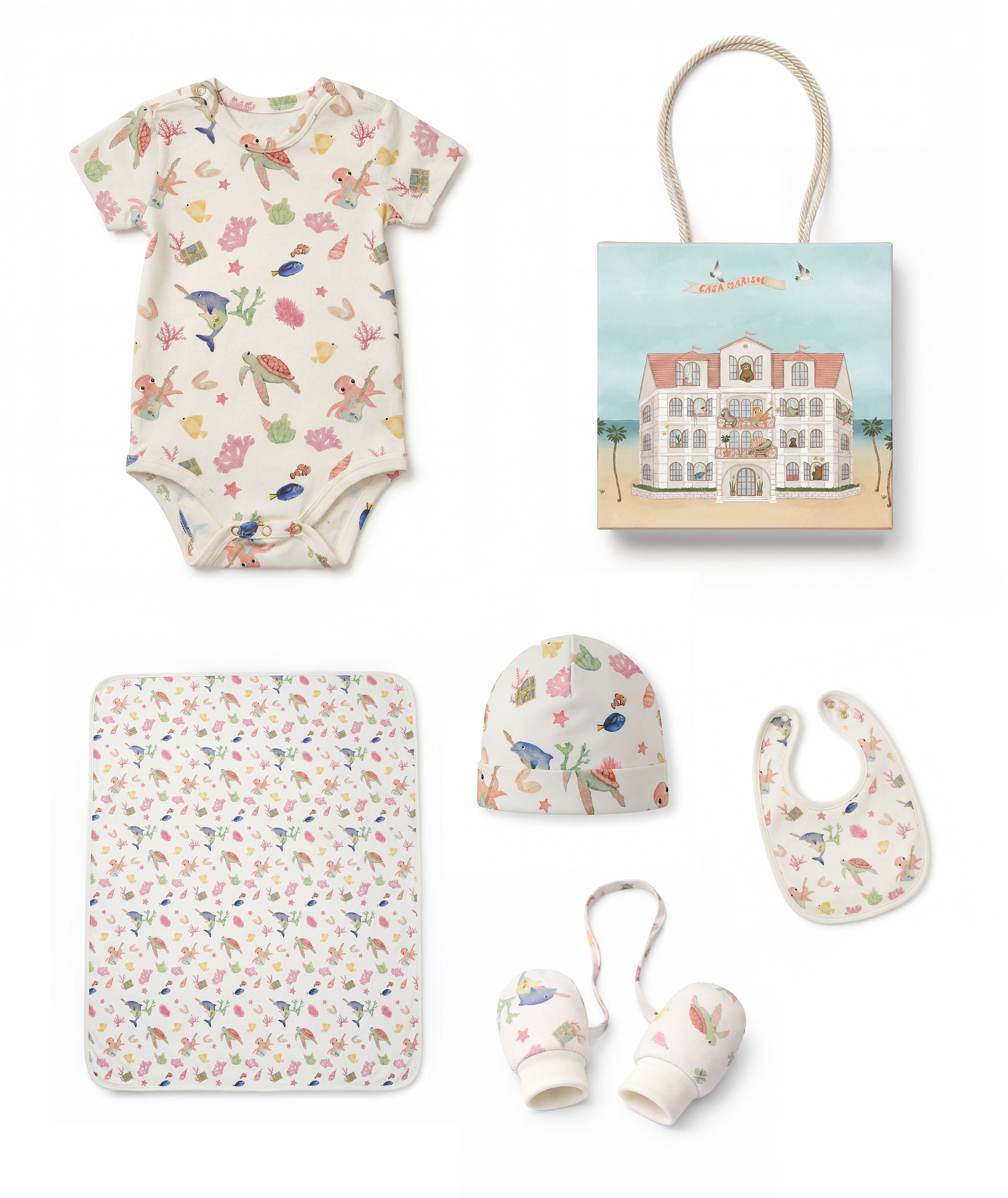 Collection of baby items including a onesie, blanket, teether, and more on a white background.