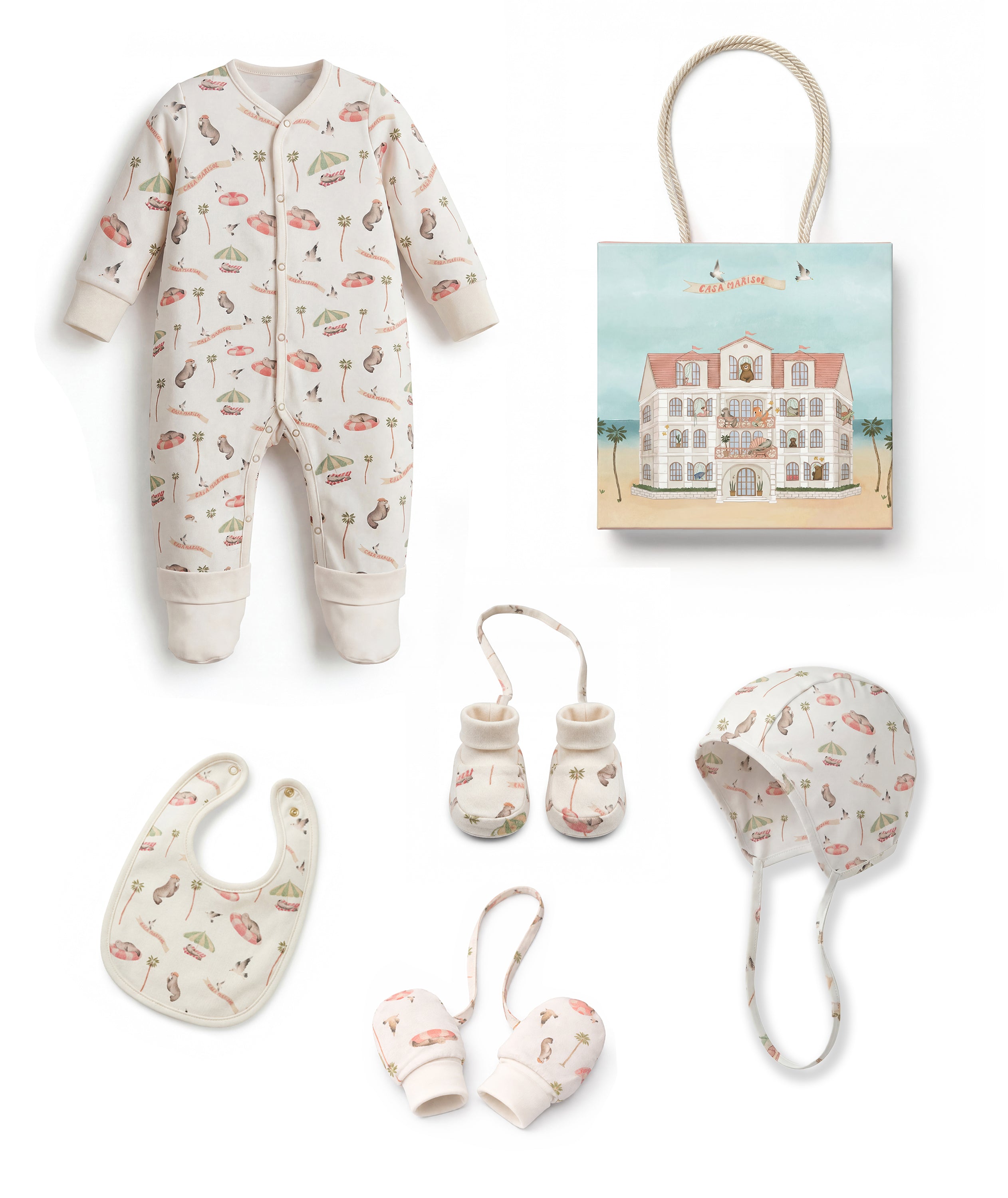 Baby clothing and accessories set including a onesie, bib, booties, and hat on a white background.